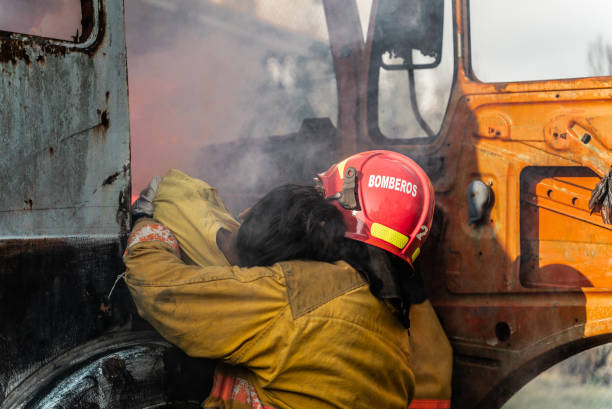 istock Firefighters removing an accident victim from inside the truck 1989834146