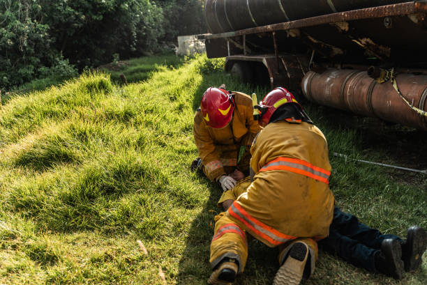 istock Firefighters helping a car accident victim 1989834554