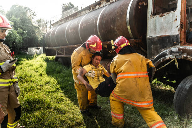 istock Firefighters helping a car accident victim 1989834675