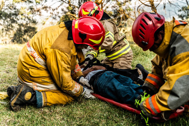 istock Firefighters helping a car accident victim 1989835226