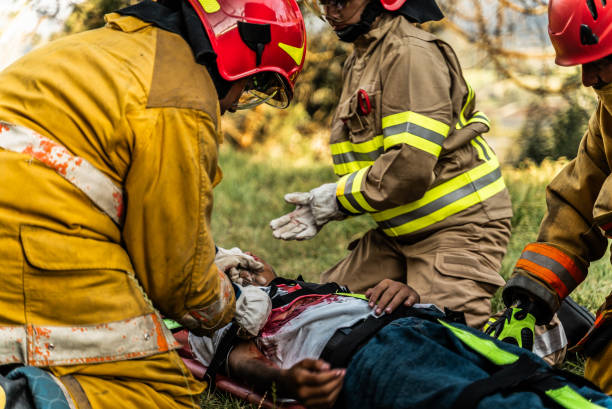 istock Firefighters helping a car accident victim 1989835740