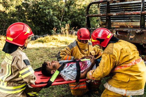 istock Firefighters helping a car accident victim 1989835748