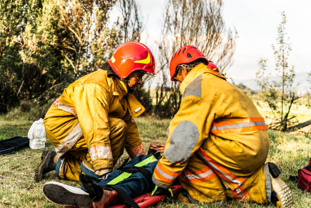 istock Firefighters helping a car accident victim 1989835752