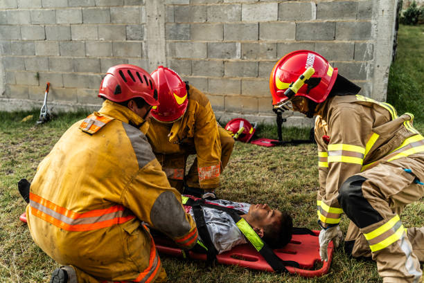 istock Firefighters helping a car accident victim 1989835756
