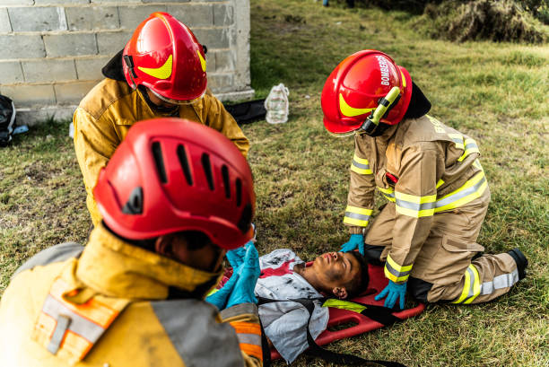 istock Firefighters helping a car accident victim 1989835771