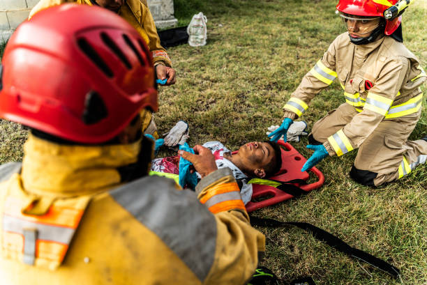 istock Firefighters helping a car accident victim 1989835772