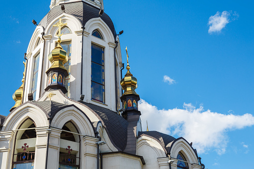 Golden dome of the Orthodox church on the blue sky background. Orthodox Church. Temple