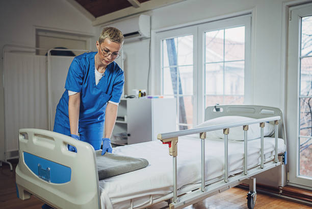 istock Nurse making bed at the hospital 1989876762