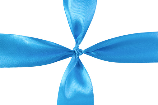 A satin dark blue ribbon tied in a gift bow. On white background with clipping path.