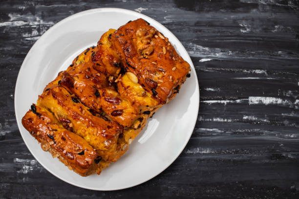 istock typical portuguese fruit cake Bolo rainha on white plate 1989882070