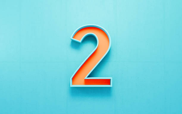 istock Orange Number Two On Blue Concrete Wall Background 1989905636