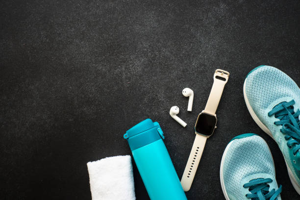istock Fitness equipment at black background top view. 1989913031