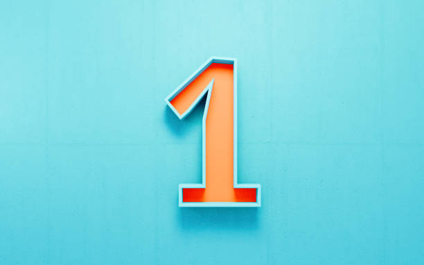 istock Orange Number One On Blue Concrete Wall Background 1989916156