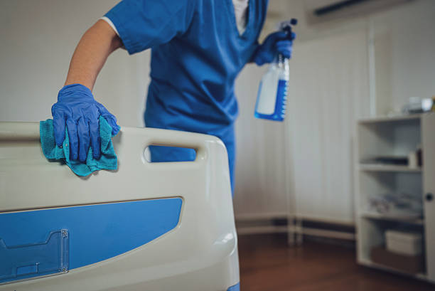 Nurse cleaning hospital ward