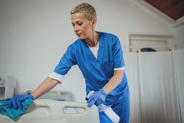 istock Nurse cleaning hospital bed 1989923542