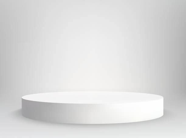 istock White empty round pedestal. White round podium advertising display of items on a white background. 1989944834