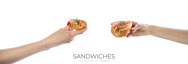 Sandwiches with red fish and greens isolated on white background. Salmon sandwiches. High quality photo
