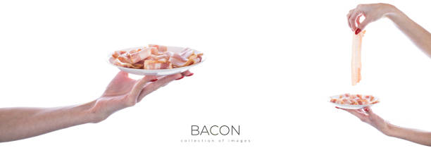 Raw sliced bacon ready for cooking isolated on white background. High quality photo