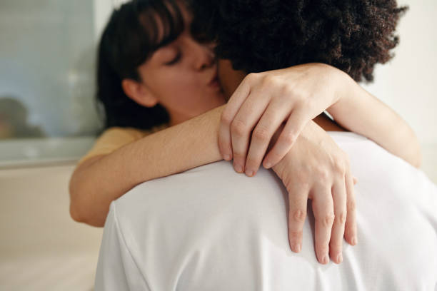 istock Hands of young woman on man back 1989968405
