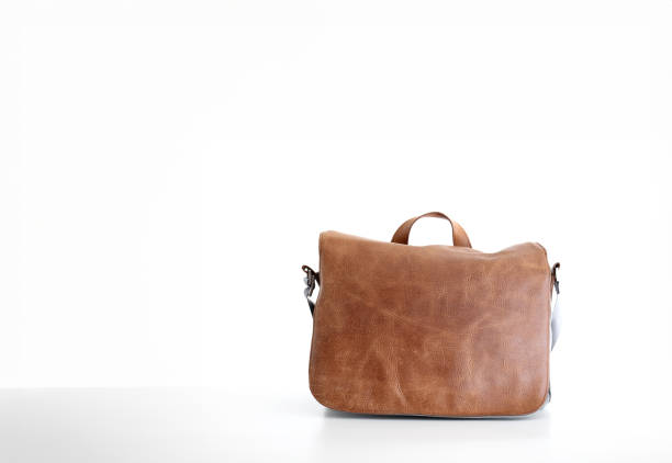 Brown fake leather men's messenger bag, isolated on white