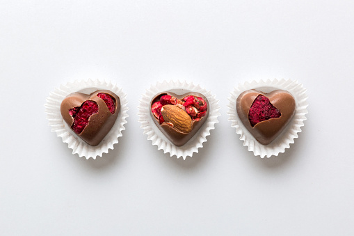 A heart shaped box of chocolates for Valentine's Day.  Isolated on white with clipping path.