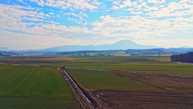 AERIAL Drone Shot of Agricultural Field Under Blue Sky During Daytime