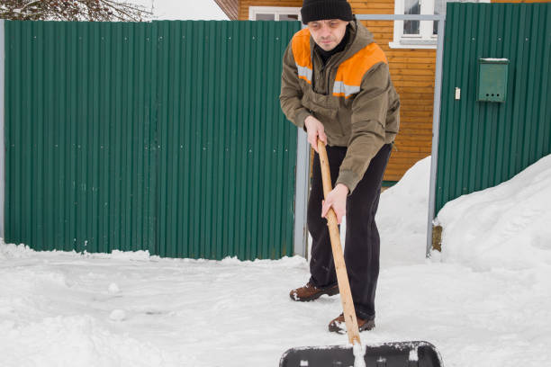 istock man removes snow 1990020052
