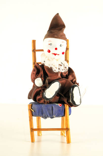 istock Pierrot toy doll on white background 1990025481