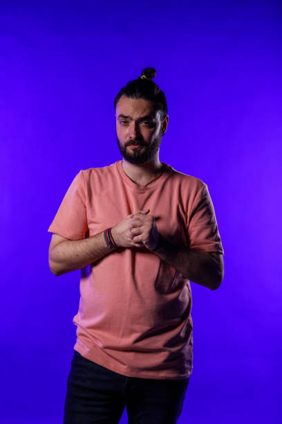 istock Man cracking his knuckles anxiously while talking to you 1990038681
