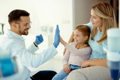 Little girl have five to dentist at dental clinic. Healthy lifestyle, healthcare, and medicine concept