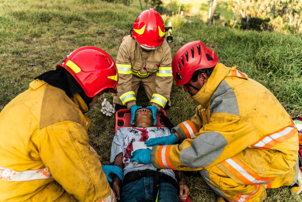 istock Firefighters helping a car accident victim 1990057804