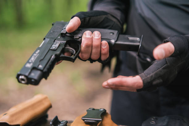 istock sports shooting instructor check your weapons close-up 1990060974