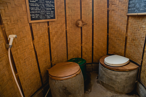 Close-up shot of sustainable eco friendly toilet in bamboo building at Bali remote village