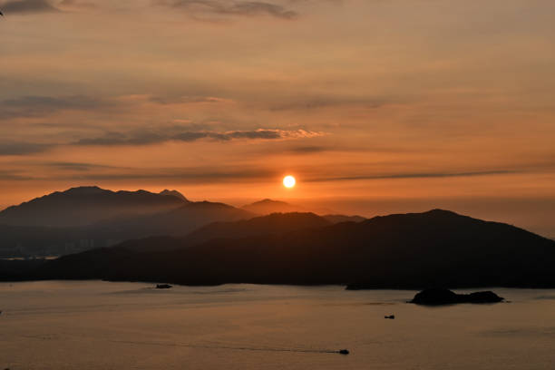 istock The sunset sink into mountains 1990080705