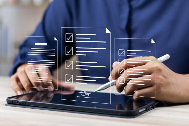 istock Electronic signature concept, E-signing, Business man using stylus pen signing contract electronic document on laptop, Document management, Sign agreement, E-documents for paperless transactions. 1990080711