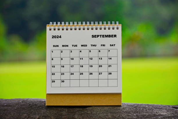 istock September 2024 white calendar with green blurred background. 1990126585