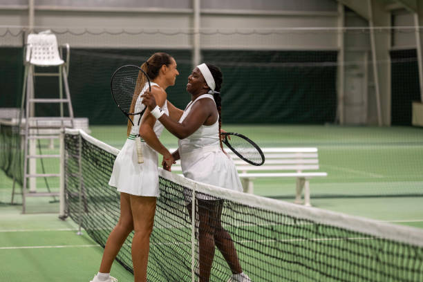 istock Tennis player shaking hands in court 1990149984