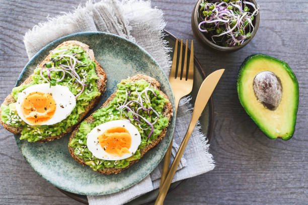 istock Healthy homemade rustic breakfast Toast With Avocado and Boiled Egg. 1990163137