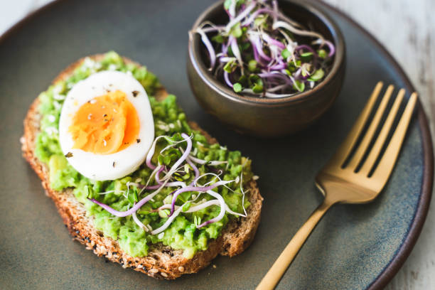 istock Healthy homemade rustic breakfast Toast With Avocado and Boiled Egg. 1990163139