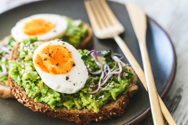 istock Healthy homemade rustic breakfast Toast With Avocado and Boiled Egg. 1990163144
