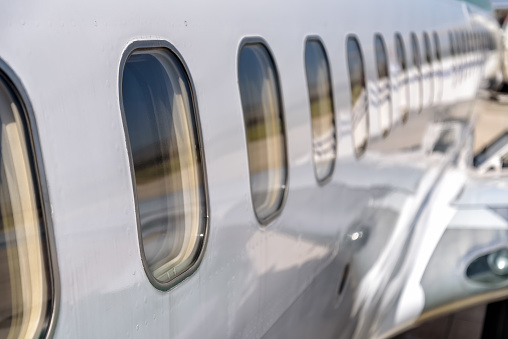 detail of a private jet parked at the airport