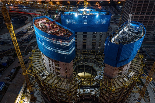 The construction site of a uniquely shaped building