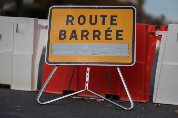 istock Closed Road Sign with Barricades. 1990195831