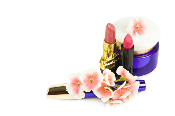 Lipstick, mascara and cosmetic face cream isolated on white background. Free space for text.