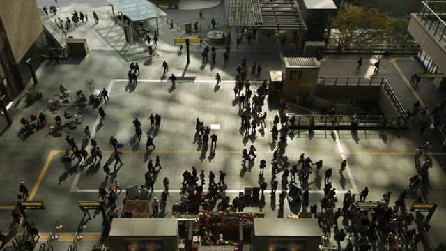 Zoomin 4k timelapse video. A bird's-eye view of a department store in Japan during a busy morning. and rushing to work