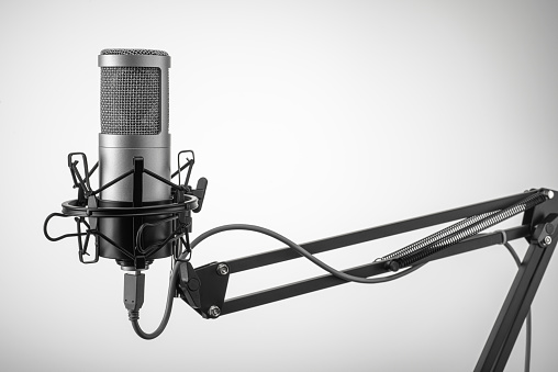 Microphone close - up on the background of a professional recording Studio, isolated on a white background. Workplace singers and musicians