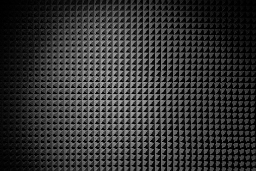 Black sound proof panel of pyramid polyurethane foam pattern texture. Acoustic foam rubber.