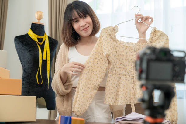 istock Young woman selling clothes online 1990253236