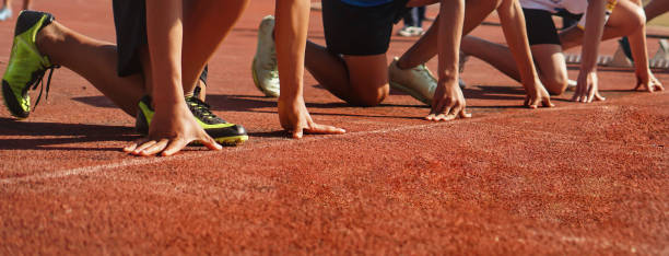istock Cropped image of a sprinter getting ready to start at the stadium 1990255461