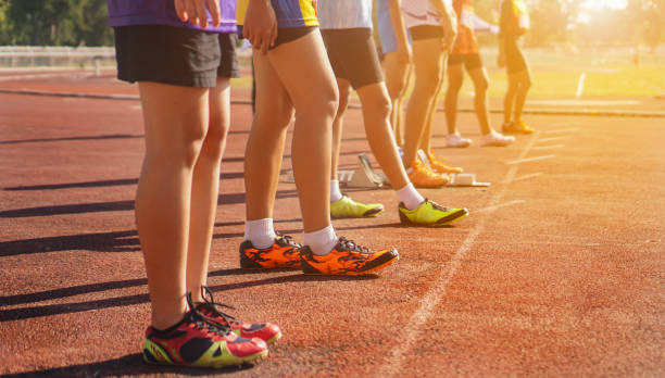 istock Cropped image of a sprinter getting ready to start at the stadium 1990255468